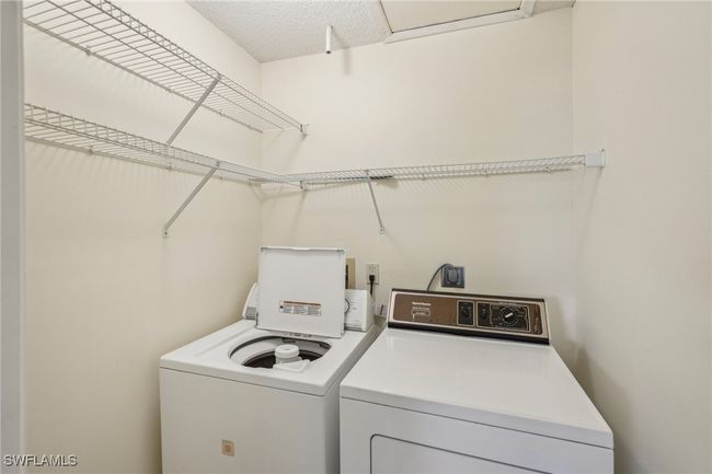 Washroom with washer and clothes dryer | Image 21