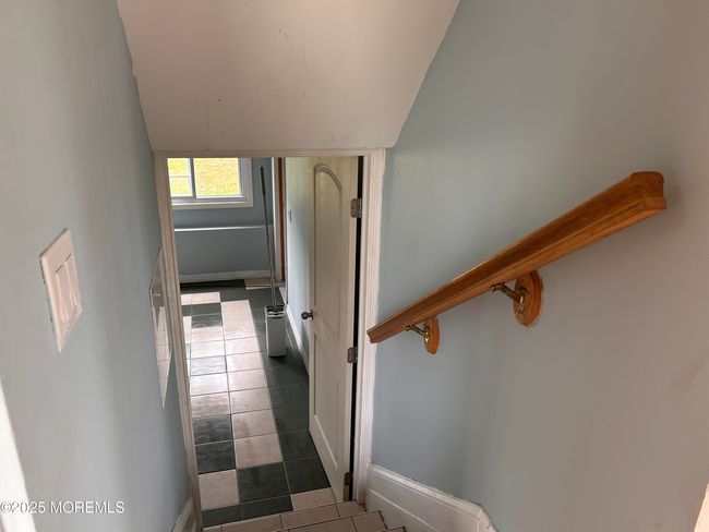 Stairway down to Huge Family room from Kitchen. | Image 26