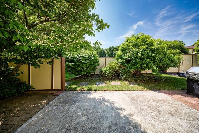 View of yard featuring a patio and a storage shed | Image 13