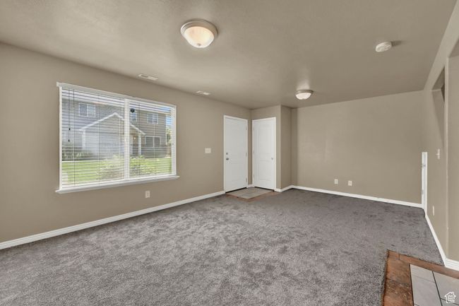 Unfurnished room featuring carpet flooring and a smoke detector | Image 9