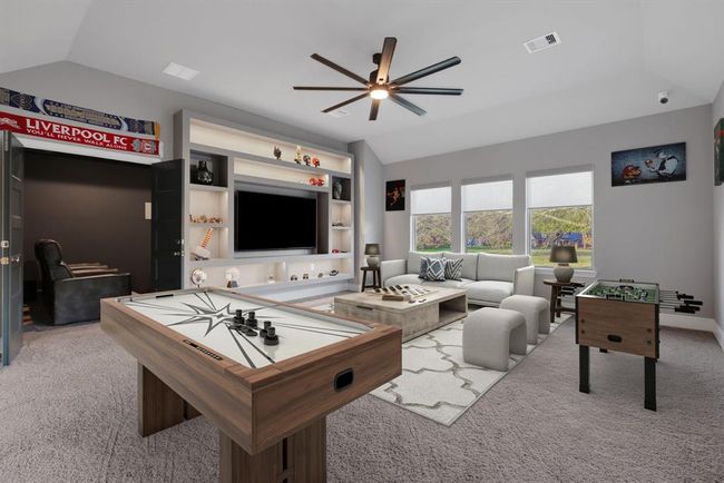 This spacious game room features built-in shelves with customer under lighting. | Image 41