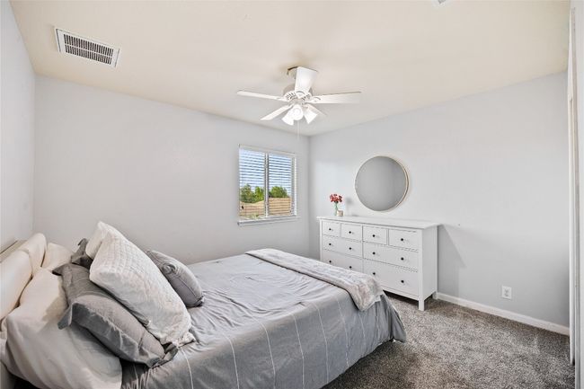 Bedroom featuring carpet flooring and a ceiling fan | Image 19