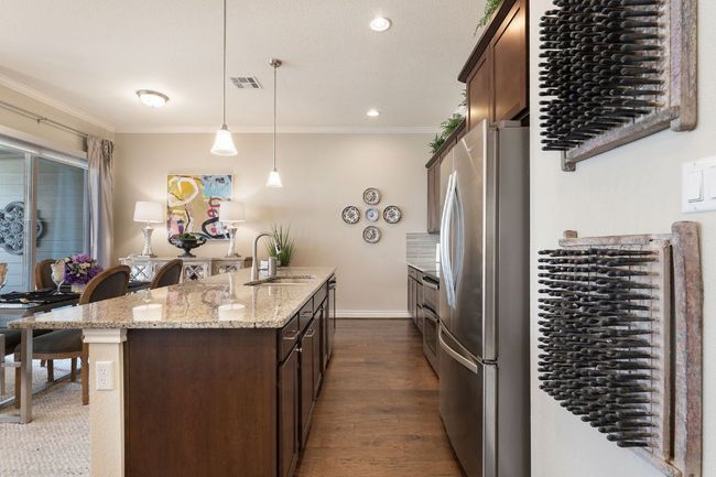 2nd Floor Kitchen with crown molding, a center island with sink, appliances with stainless steel finishes, and a sink | Image 15