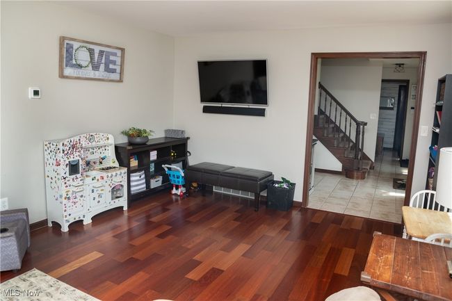 Living room featuring wood finished floors and stairway | Image 17