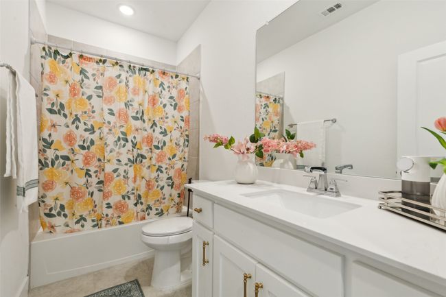 Full bath with toilet, vanity, shower / bath combo, and tile patterned flooring | Image 30