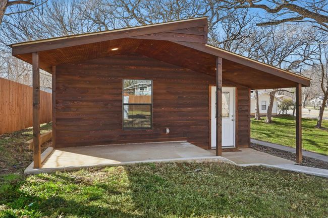 View of outdoor structure featuring fence | Image 29