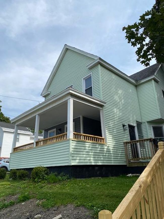View of side of home featuring a porch | Image 6
