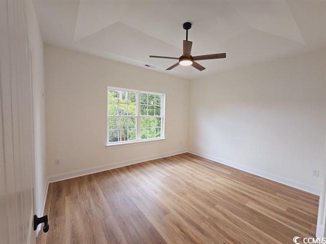 Unfurnished room with light wood-style floors, ceiling fan, and baseboards | Image 34
