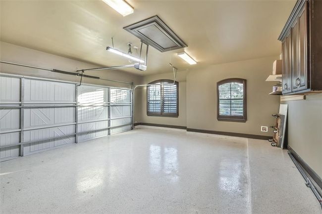 Garage with Windows and Epoxy Flooring | Image 43