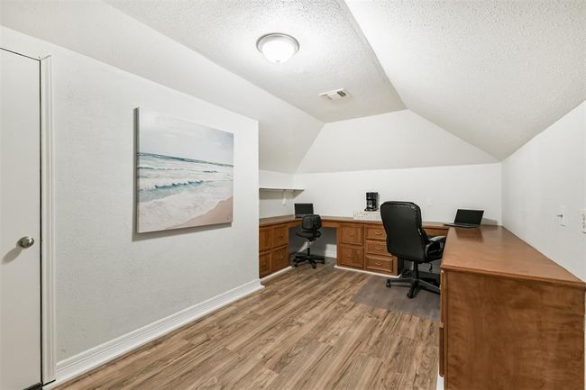 Charming office space with built-in desk and air conditioning for comfort. | Image 39