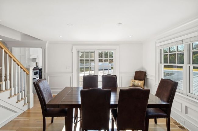 Dining area with light hardwood / wood-style floors, a wealth of natural light, and ornamental molding | Image 18
