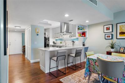 updated kitchen opens to the living and dining areas | Image 2