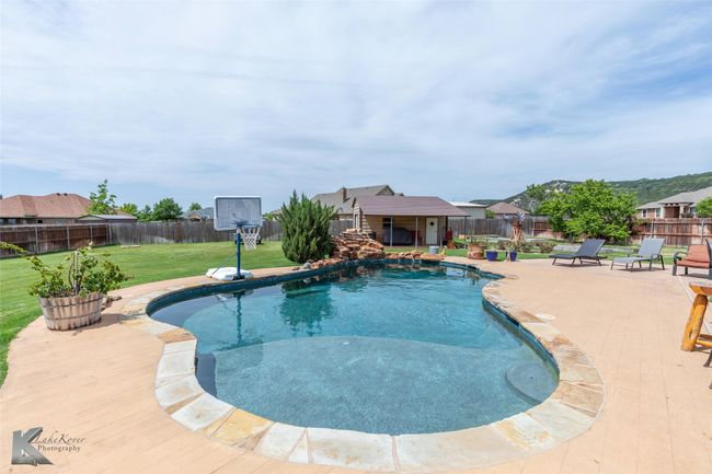 View of pool featuring a patio | Image 32