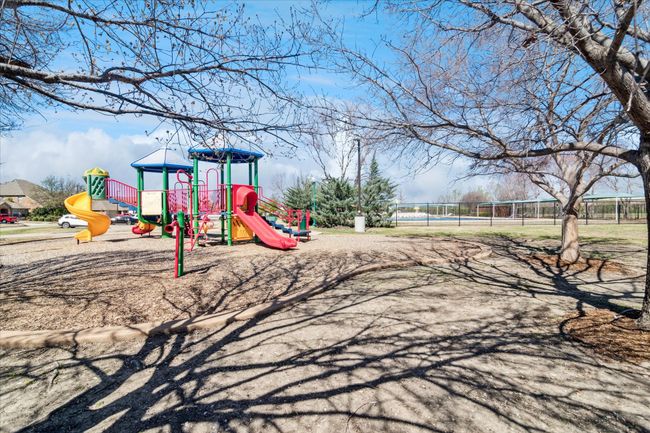 Communal playground featuring fence | Image 32