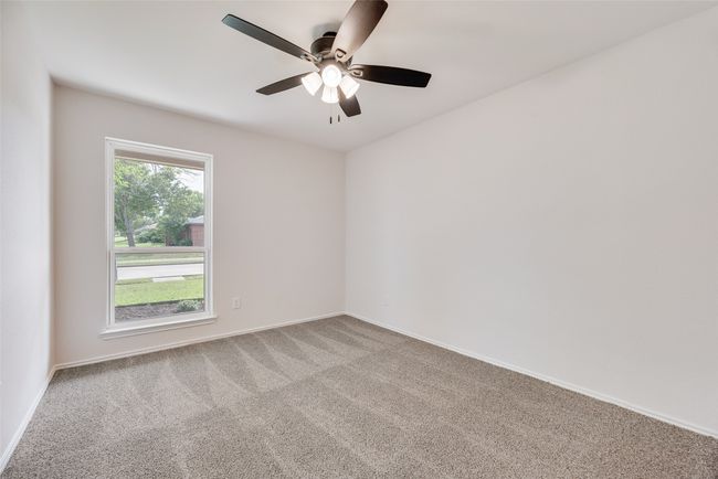 Unfurnished room featuring carpet, a ceiling fan, and baseboards | Image 18
