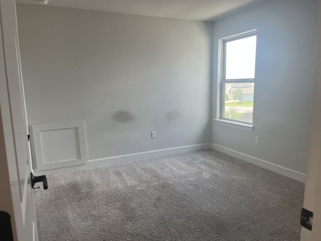 Carpeted spare room with baseboards and plenty of natural light | Image 30