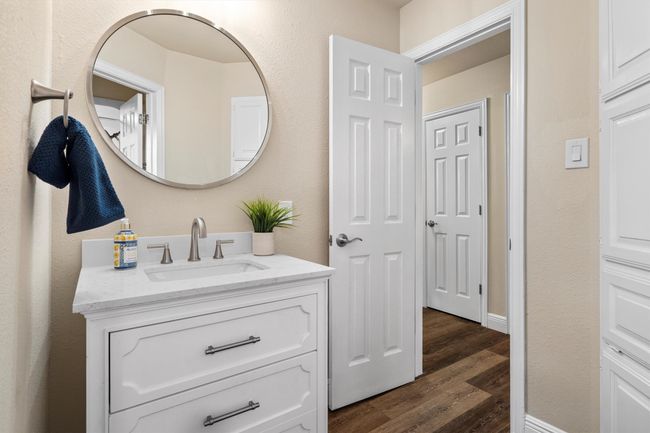 The updated full bathroom is between two of the secondary bedrooms. | Image 24