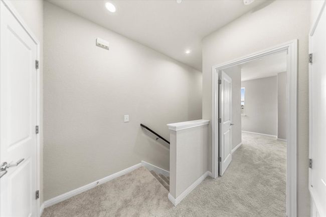 Hall featuring an upstairs landing, light carpet, baseboards, and recessed lighting | Image 28