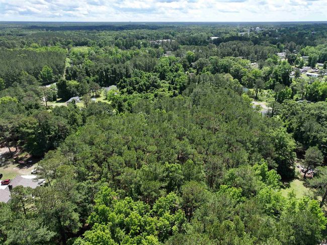 Aerial view featuring a wooded view | Image 18