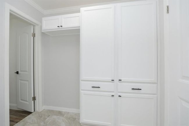 Utility room leading to 3 full bathroom & 4 bedroom/flex space | Image 15