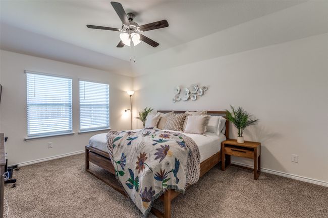 Primary Bedroom View 1 featuring carpet, and ceiling fan | Image 14