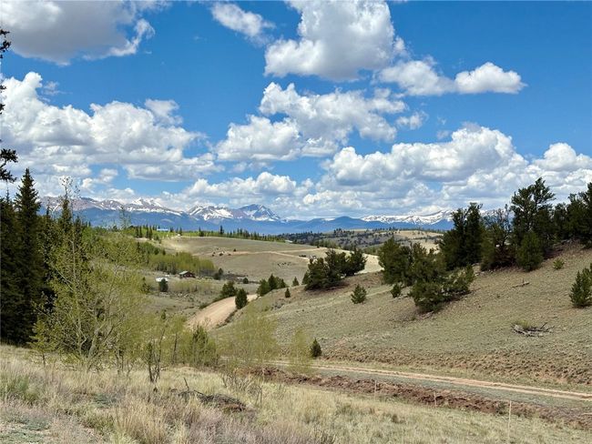 View of mountain backdrop featuring rural landscape | Image 26
