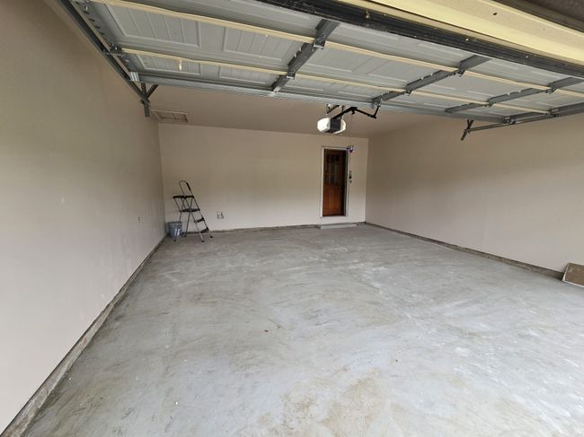 Garage with a garage door opener | Image 25