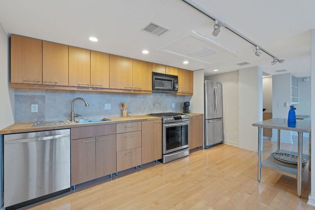 Plenty of elbow room in this kitchen. Steel table is movable, fyi. | Image 6