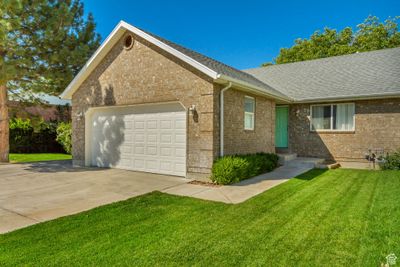 Exterior space with a garage and a front yard | Image 1