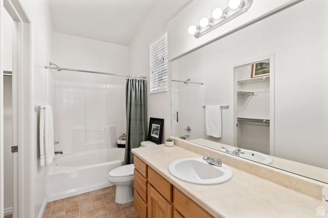 Bathroom featuring shower / tub combo, vanity, and toilet | Image 10