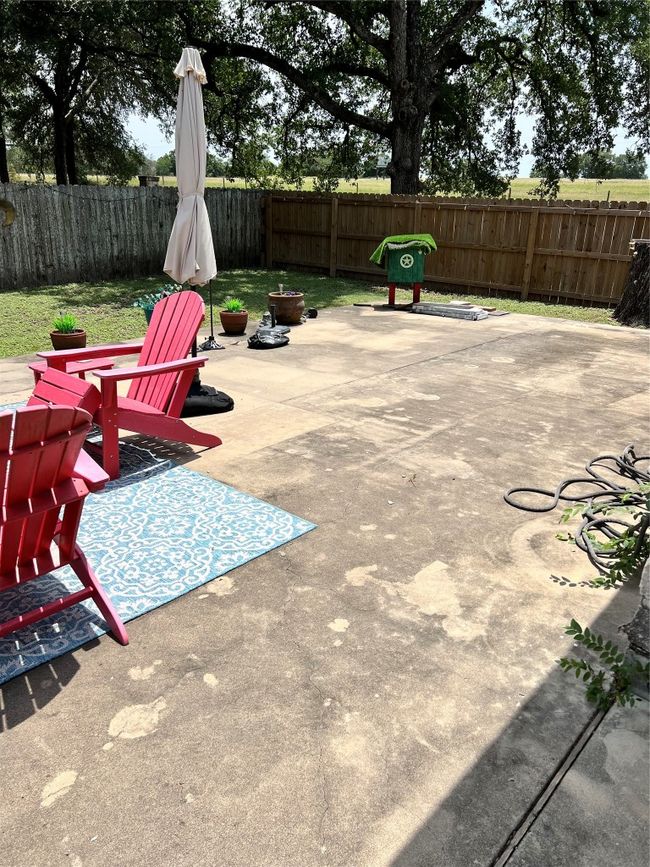Fenced backyard featuring a patio | Image 4