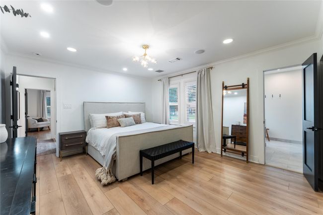 Spacious primary suite with modern light fixtures and fresh interior touches | Image 14