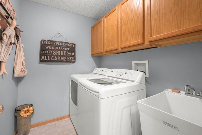 Laundry Room has access to master closet in the cabinet. | Image 13