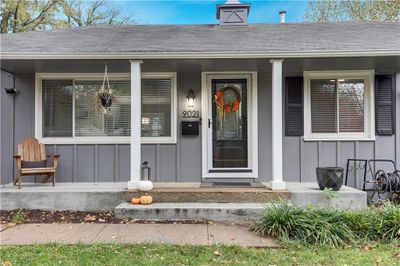 Doorway to property featuring a porch | Image 2