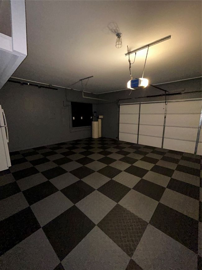 Garage with a garage door opener | Image 17