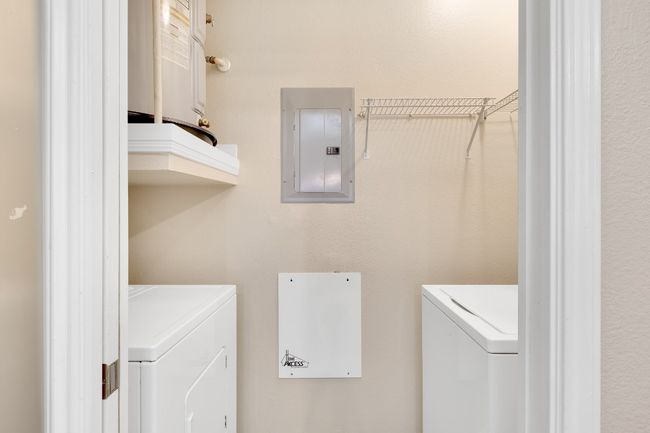 Laundry area with electric washer and dryer. All new paint. | Image 19