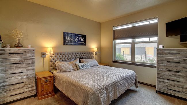 Primary Bedroom suite with two closets, one a walk-in, neutral shades on the wall and carpet. Top down bottom up shades for privacy. | Image 7