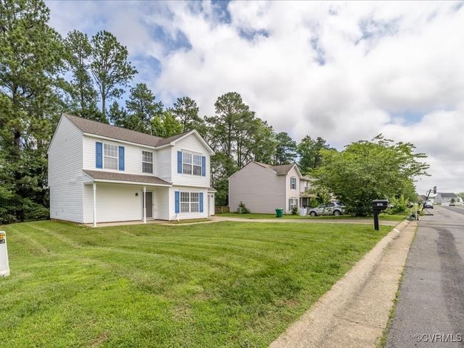 View of front facade with a front yard and roof with shingles | Image 28