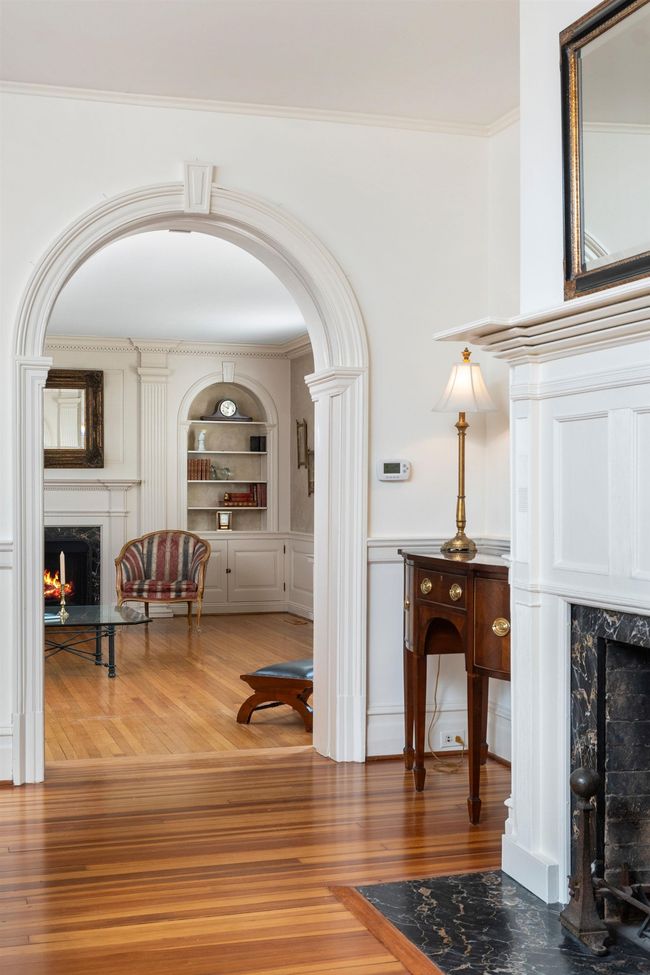 The living room and primary bedroom addition was completed in 1926 with very extensive detail in all the wood work and keystone archway. | Image 13