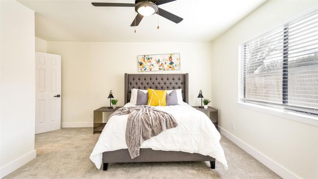 Carpeted bedroom featuring baseboards and a ceiling fan | Image 23