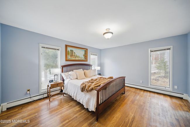 Primary Bedroom with Newer Bathroom with 2 sinks & great design, large windows & builtins in large closets. | Image 20