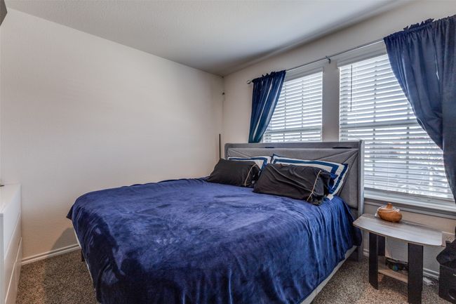 Bedroom with carpet flooring and baseboards | Image 18