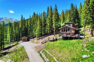 Deck with an outdoor living space and a mountain view | Image 1