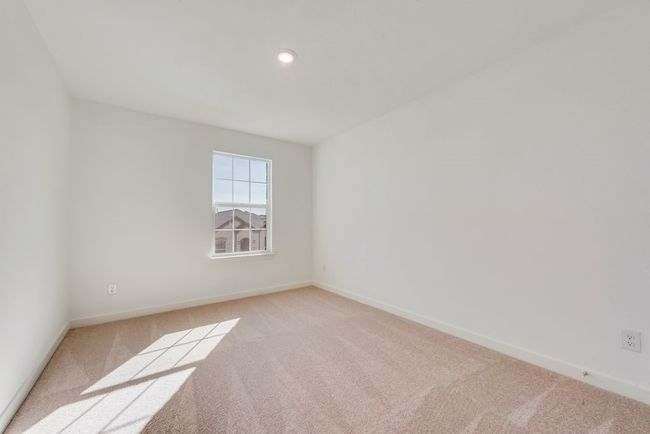 Empty room with light carpet and recessed lighting | Image 8