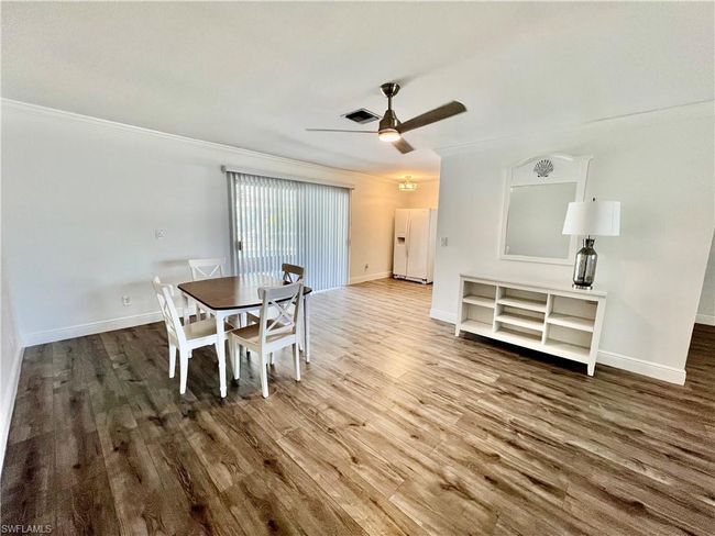 Dining area with LUXURY VINYL PLANK FLOORS. | Image 17