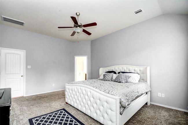This lovely room is your private retreat with tranquil views of your backyard and tons of natural light. | Image 18