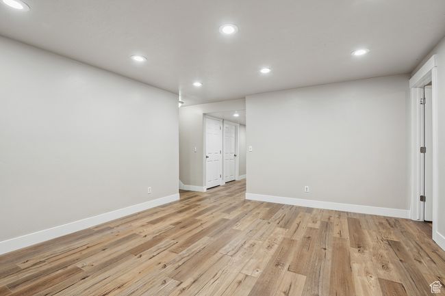 Spare room featuring light wood-type flooring | Image 27
