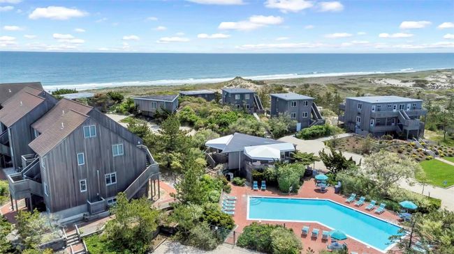 Bird's eye view featuring a view of the beach and a water view | Image 7