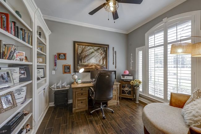 Home office featuring a healthy amount of sunlight, wood finish floors, and ceiling fan | Image 8