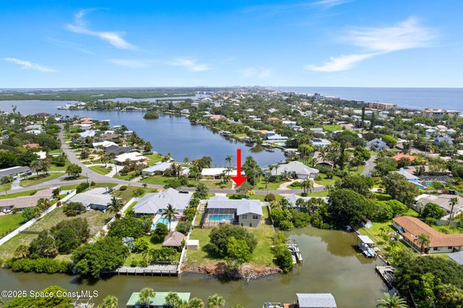 Ariel of home and canal leading to Banana River access, ocean on the right | Image 86